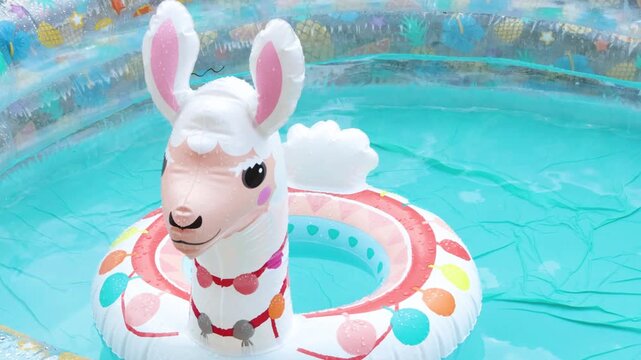 Inflatable pool in summer with swimming lap. Children and water games. Summer fun. 