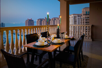 Dinner Table in Terrace Pearl Qatar Porto Arabia. Candle light dinner 