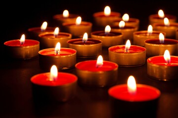 Candles Grouped Together on Dark Background - Elegant 4K Video
