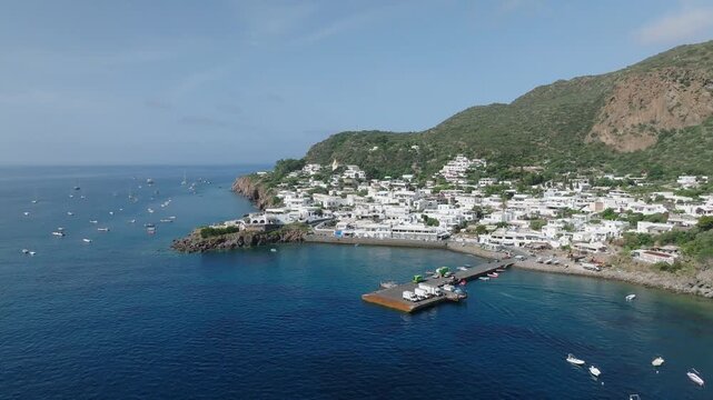 4K Aerial of Panarea, Aeolian Islands. Monring Light Slow push in orbit towards the harbour