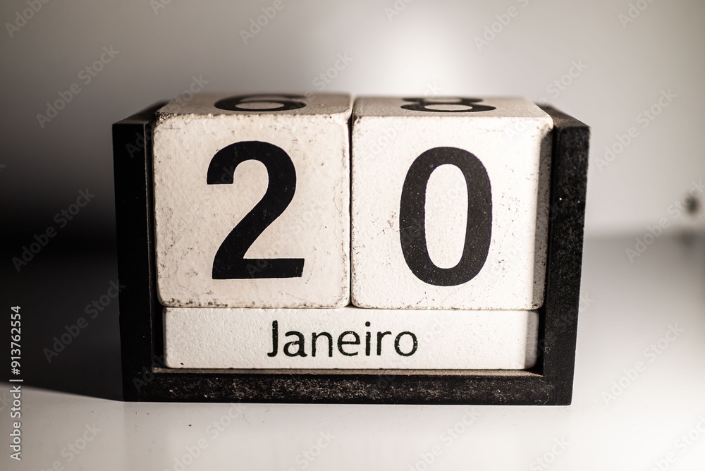 Wall mural wooden perpetual calendar showing january 20th with a minimalistic background