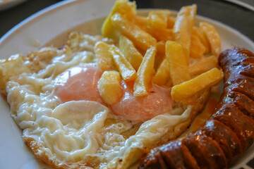 Fried eggs with chorizo ​​and potatoes, a traditional dish from Spain