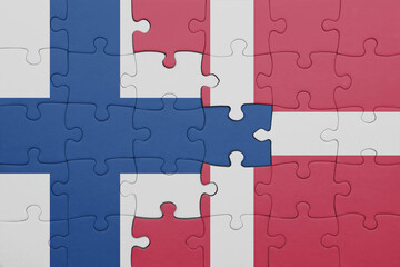 puzzle with the colourful national flag of denmark and flag of finland.