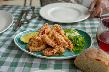 Rabas plate fried calamari with salad in traditional restaurant Cantabria Spain