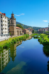 Balmaseda Basque country Spain on July 9, 2024. San Juan del Moral romanesque church by the river.