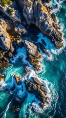 The image captures a dramatic aerial view of a rugged coastline where rocky cliffs meet the turbulent ocean.