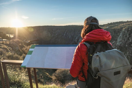 Hiker watching birds at a scenic lookout in Salamanca