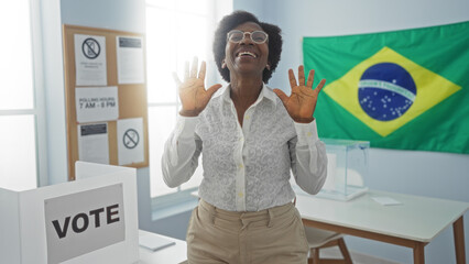 Woman celebrating in voting room with brazilian flag background and electoral materials visible