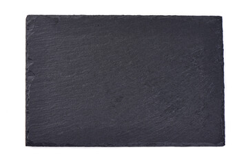 Rustic black slate stone plate, isolated on white background.