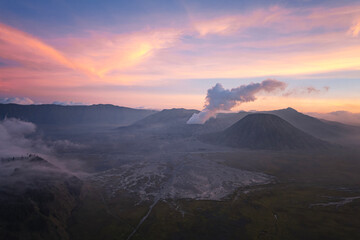 Fototapeta premium the sunset of Bromo, Indonesia with dramatic sky