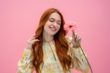 Fototapeta premium Long-haired caucasian young woman smiling and looking happy and relaxed