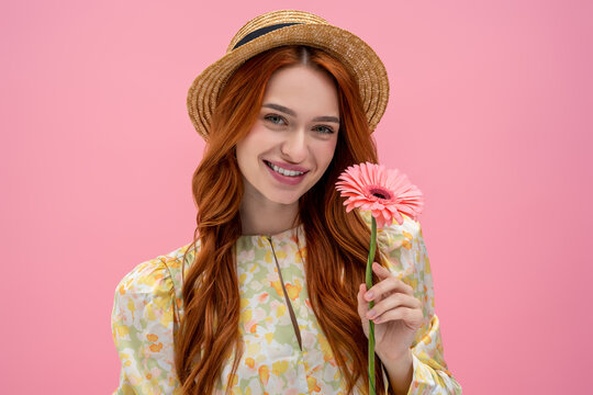 Sweet long-haired young caucasian woman looking happy and relaxed