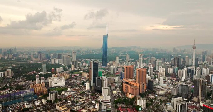 Drone flight toward Merdeka 118 skyscraper and city skyline view of Kuala Lumpur