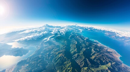 Aerial View of Mountains and Coastline with Clear Blue Sky