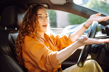 Portrait young woman driving car. Young traveler driving. Car travel, lifestyle concept.