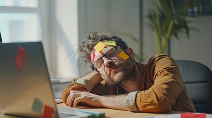 A man, exhausted, has fallen asleep at his desk with colorful sticky notes covering his face, capturing the chaos and fatigue of office life.