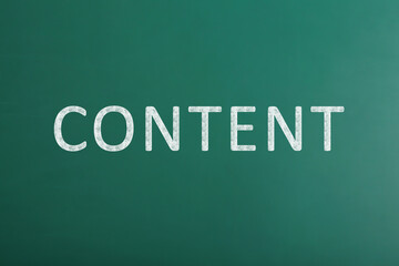 Green chalkboard with written word Content, closeup