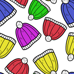 Autumn and winter seamless vector pattern with colorful hats. Simple doodle style