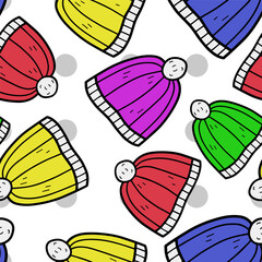 Autumn and winter seamless vector pattern with colorful hats. Simple doodle style