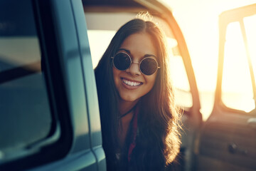 Travel, break and woman with sunglasses in portrait for outdoor summer vacation, sunset and road trip. Drive, adventure and person with smile by car door for tourism, holiday or sightseeing in Greece