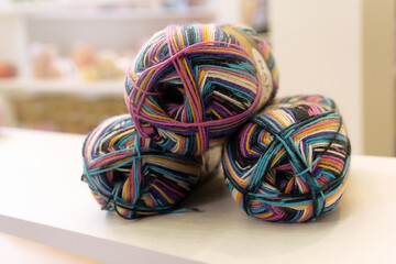 Colorful yarn balls on display at craft store.