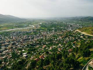 BERAT, ALBANIA, April 13, 2024: Berat castle viewed from boulevard Republika in Albania