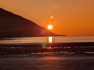 Blazing Sunset Over Coastal Mountains