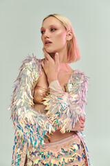 A young woman showcases her trendy, iridescent outfit with poise.