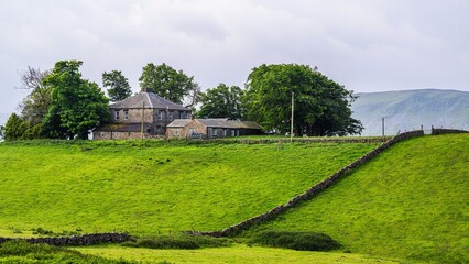 Farms over Upper Teesdale and River Tees, Forest-in-Teesdale village, County Durham and Cumbria, England, United Kingdom