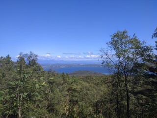 Fototapeta premium Enjoy the stunning coastal view, surrounded by water and islands, captured in an aerial shot