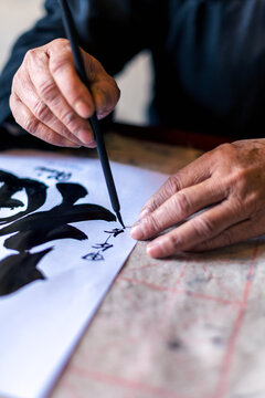 Vietnam, Hanoi. Vietnamese calligrapher writing, close up