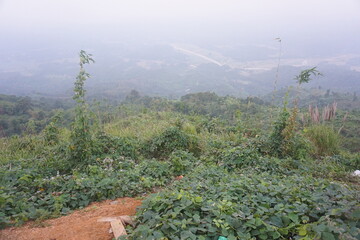 landscape in the morning fog. Beautiful Maraingtong Hill, clouds over the mountains, view from the...