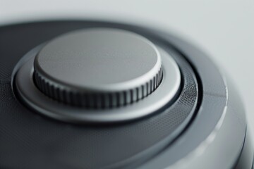 A close-up shot of a push-button with a prominent tactile bump, inviting users to press and feel the satisfying click. The button's surface is slightly worn, indicating frequent use.