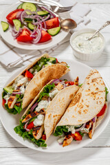 grilled chicken street tacos on a white plate