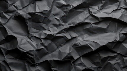 Vintage black crumpled paper background 