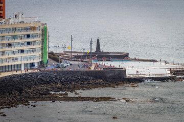 Seascape. Calm sea. Sunset at sea. Views of the village of Bajamar and natural pools. Tenerife, Bajamar, Canary Islands.