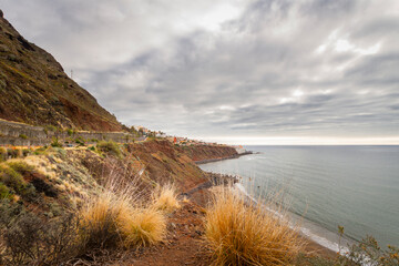 Seascape. Calm sea. Ocean views from the cliff. Sunset at sea. Views of the village of Bajamar and natural pools. Tenerife, Bajamar, Canary Islands.