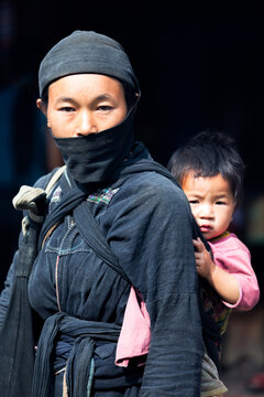 Portrait of woman and baby from Dan Toc La Chi tribe, Bac Ha, Vietnam