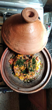 Traditional Moroccan Tagine Cooking on Stove

