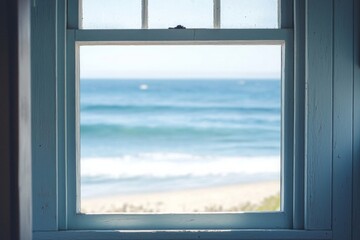 A window in a small coastal cottage, overlooking a serene beach with gentle waves.