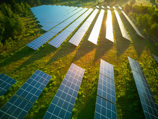 Solar panel produces green, environmentaly friendly energy from the setting sun. Aerial view from...