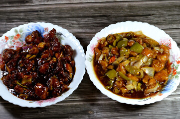 Chinese food, traditional Chinese chicken cuisine of grilled chicken pieces with soy sauce, bell peppers and chili peppers, onions and spices, usually served with rice or noodles with soy sauce