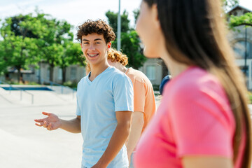 Stylish authentic teenagers meeting together, talking, communicating