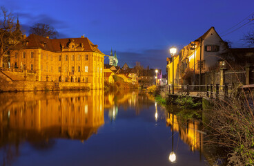 Obraz premium Illuminated night view of St Michaels Monastery and the Regnitz River in Bamberg Germany