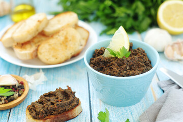 A bowl with tapenade - traditional olive dip in Mediterranean region