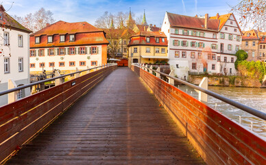View of a bridge over the Regnitz River and colorful historic buildings in Bamberg, Germany