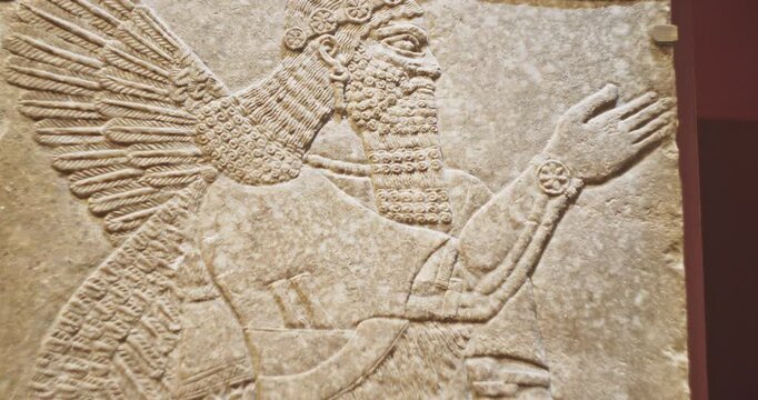 Winged Figure. Architectural Fragment Of Panel From Northwest Palace Of Ashurnasirpal Ii By Neo Assyrian Period. Depicted Is Winged Human Divine Spirit, Protective Spirit. Chosen Viceroy And High