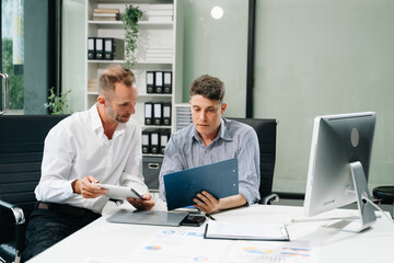 Obraz premium Male discussing new project with male colleague. .Caucasian man talking