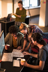 Team of architects collaborating on project in modern office