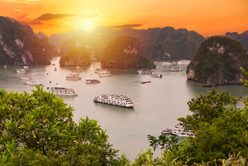 Beautiful landscape of Ha Long bay in Vietnam on sunset, many islands and boats